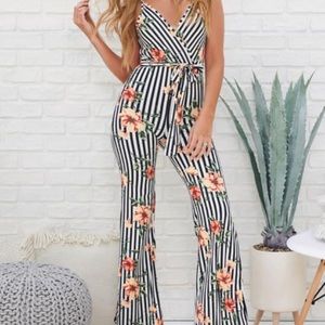 Nanamacs boutique. Goal getter floral jumpsuit.